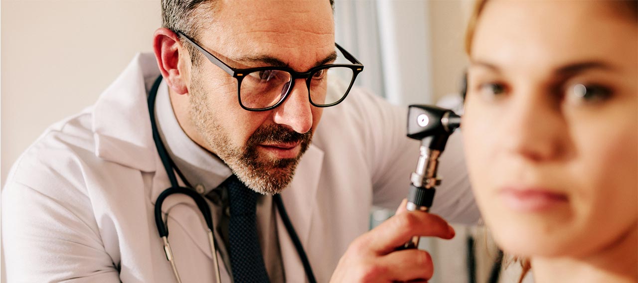 ENT doctor checking ears