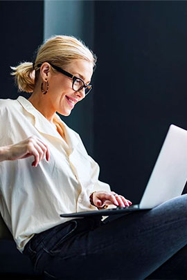 lady reviewing Chubb customarq package policy coverages on laptop